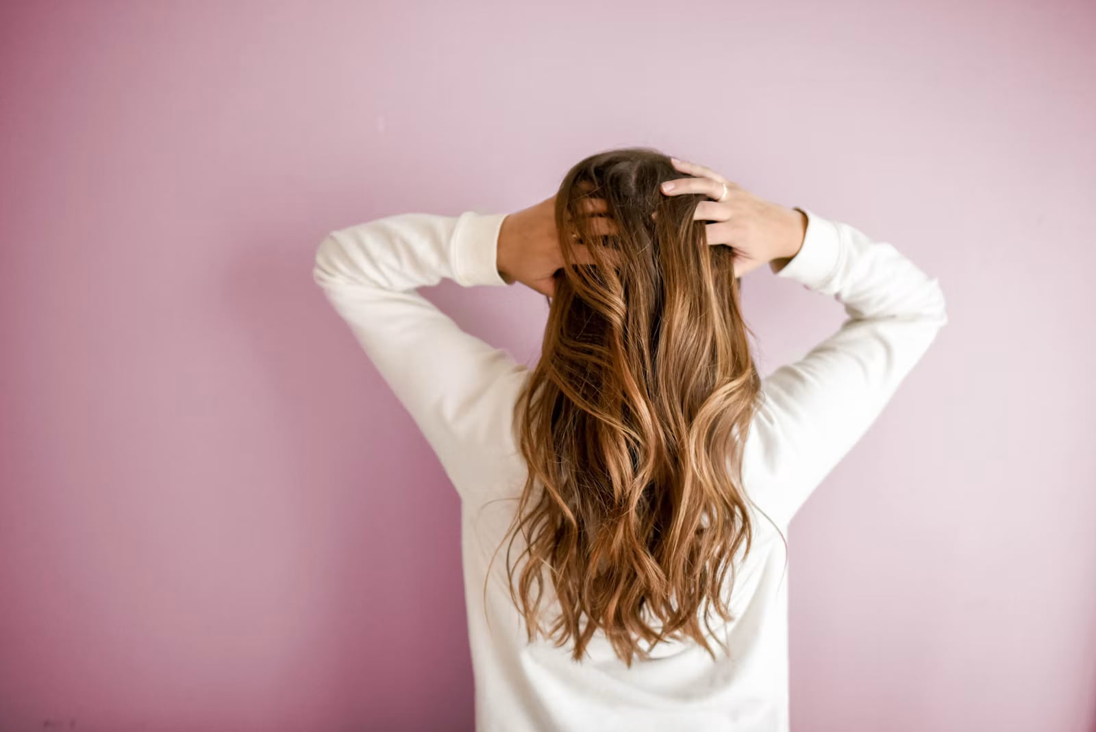 Cosmetic dermatologist examining client skin under clinical light